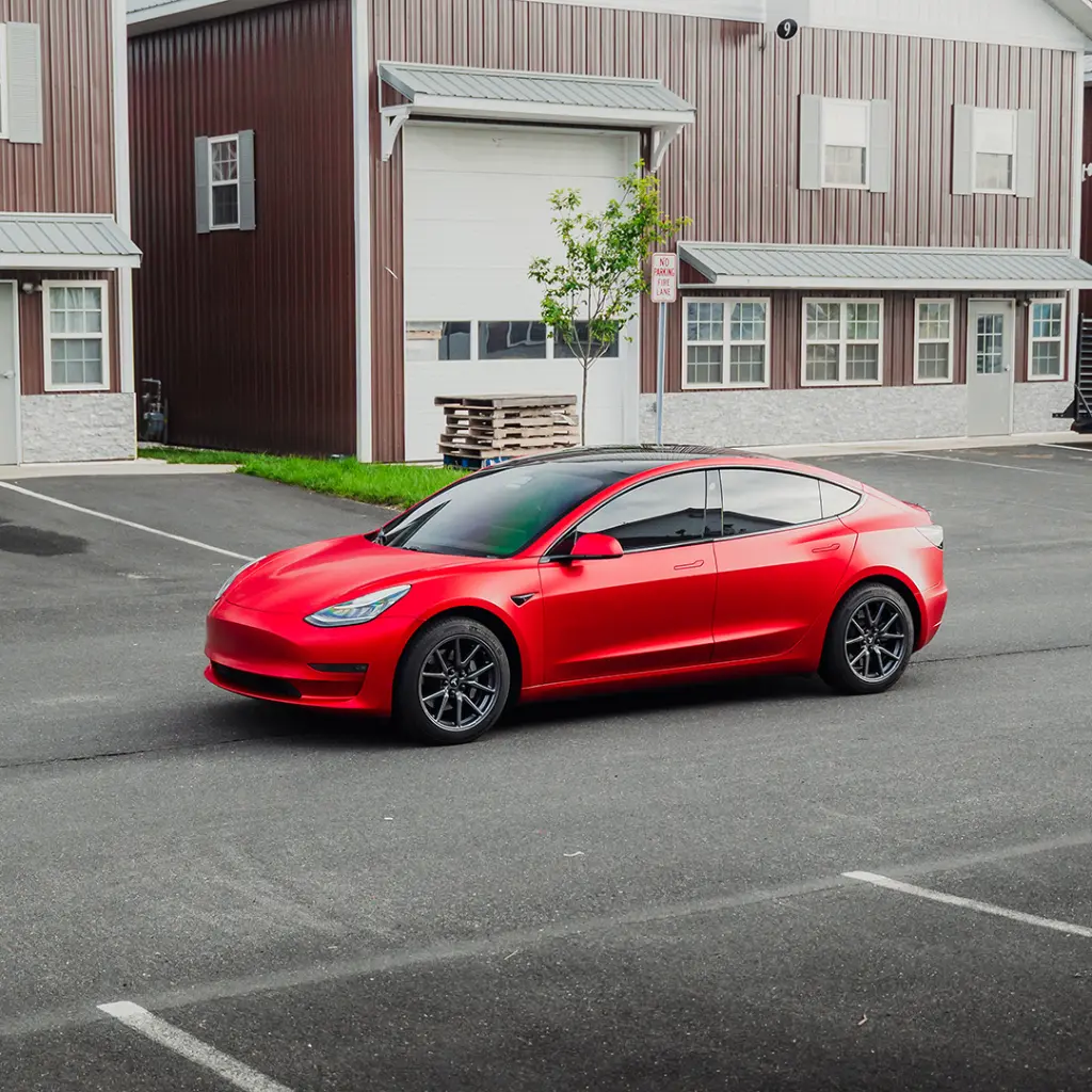 EVOLV-Inferno-Red-PPF-Tesla-Model3-sideview.webp